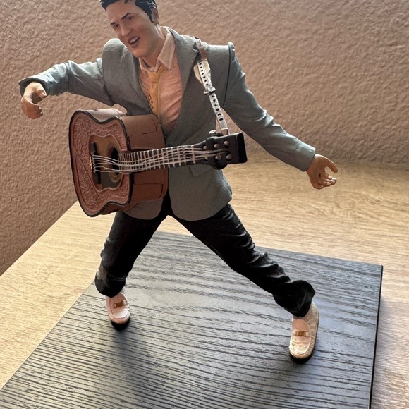 Figure with Guitar in Blue Suit